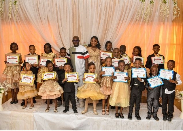 Dandave School graduation ceremony, pupils holding certificates with school directors